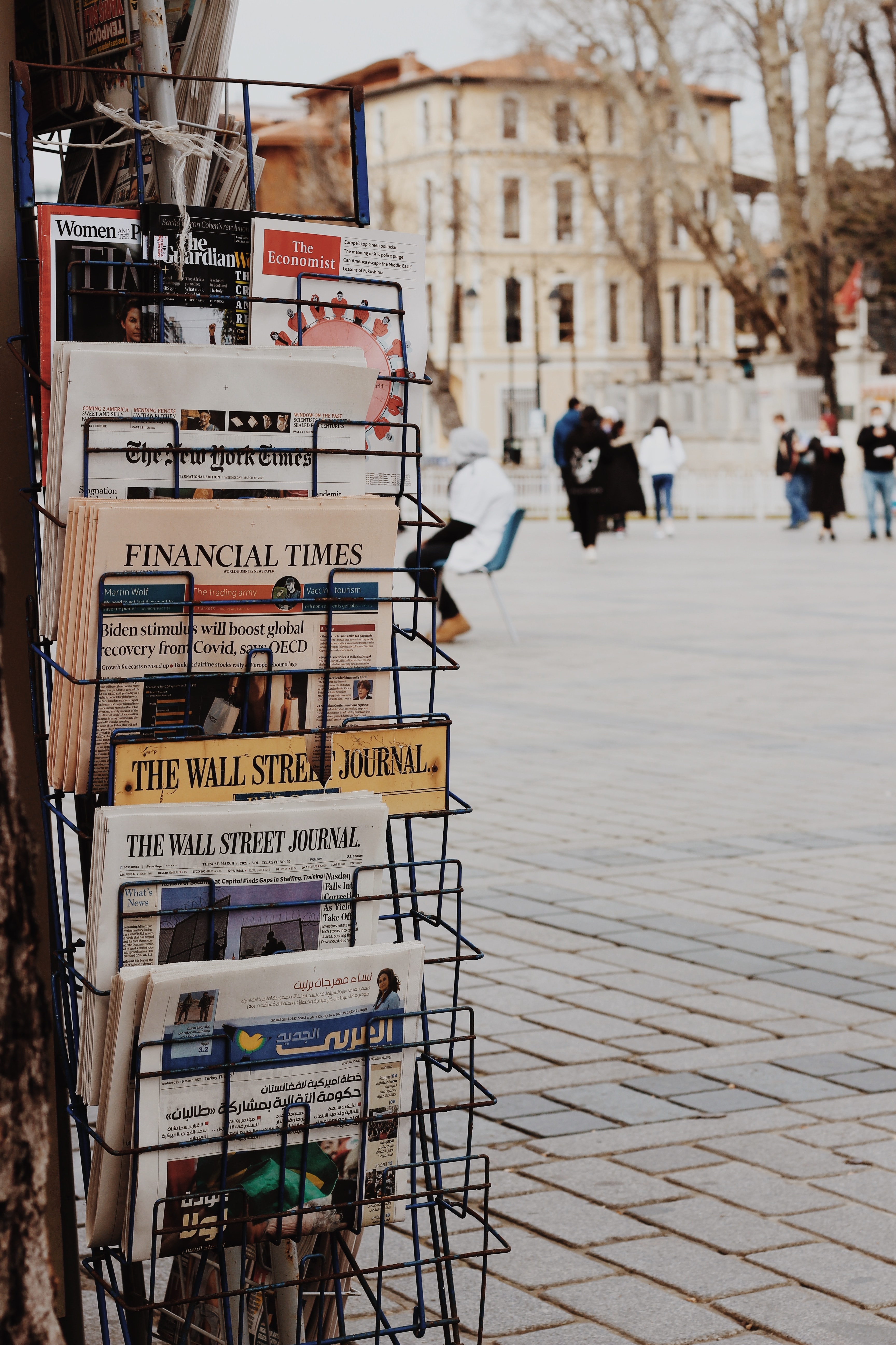 A newstand featuring the Wall Street Journal and the Financial Times, useful independent sources for researching stocks.